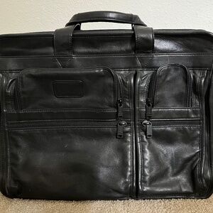 TUMI Leather Expandable Briefcase with Shoulder Strap - never been used